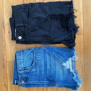Pair of jean shorts. Black and blue jean from fashion nova.